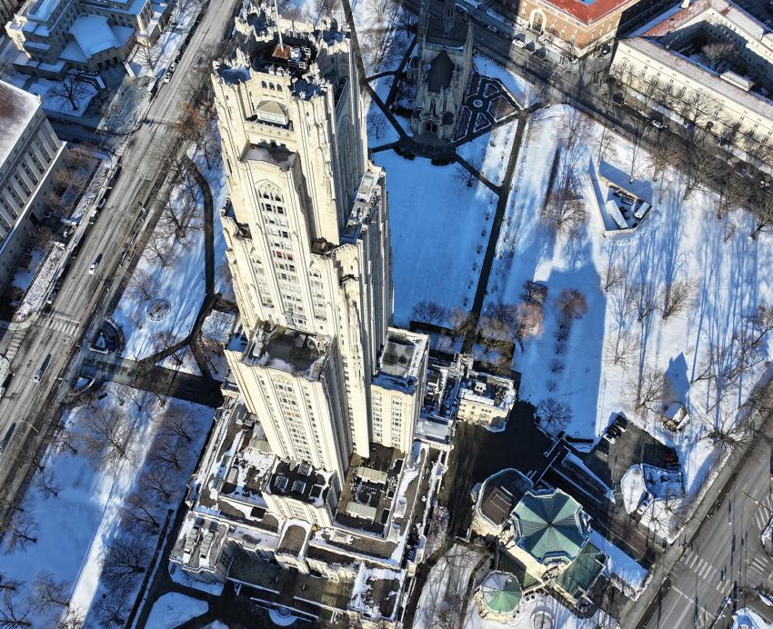 Aerial photo of the Cathedral of Learning and Heinz Chapel during the winter.