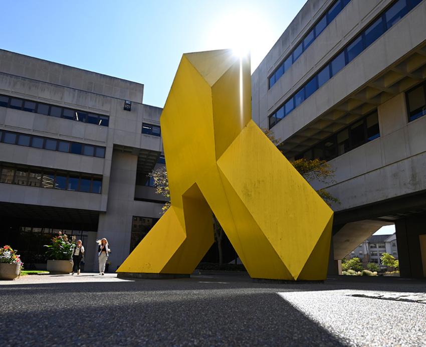 An abstract yellow sculpture outside Pitt's Posvar Hall