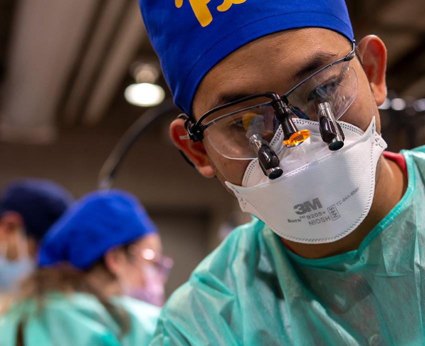 Dental techincian with mask and glasses