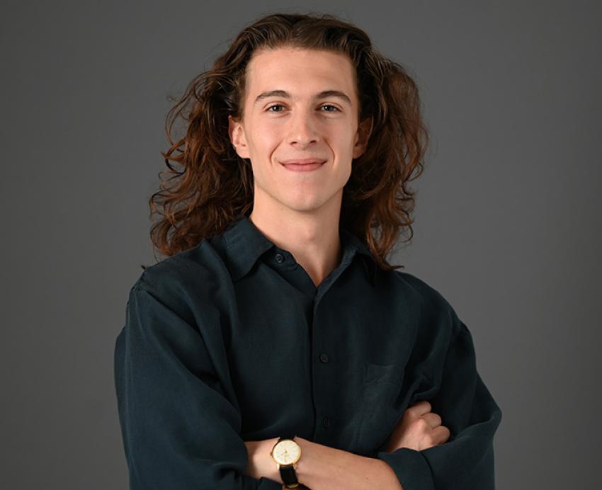 Ryan Willis standing in front of a grey background