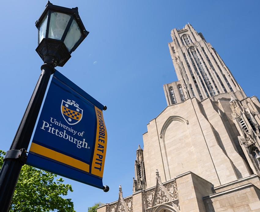 Cathedral of Learning with lamp sign that reads "University of Pittsburgh: It's Possible at Pitt"