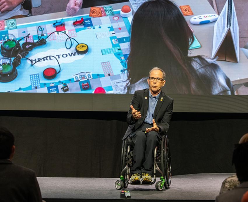 Rory Cooper speaking in front of an audience