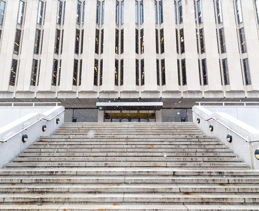 Steps lead to a Hillman Library entrance.