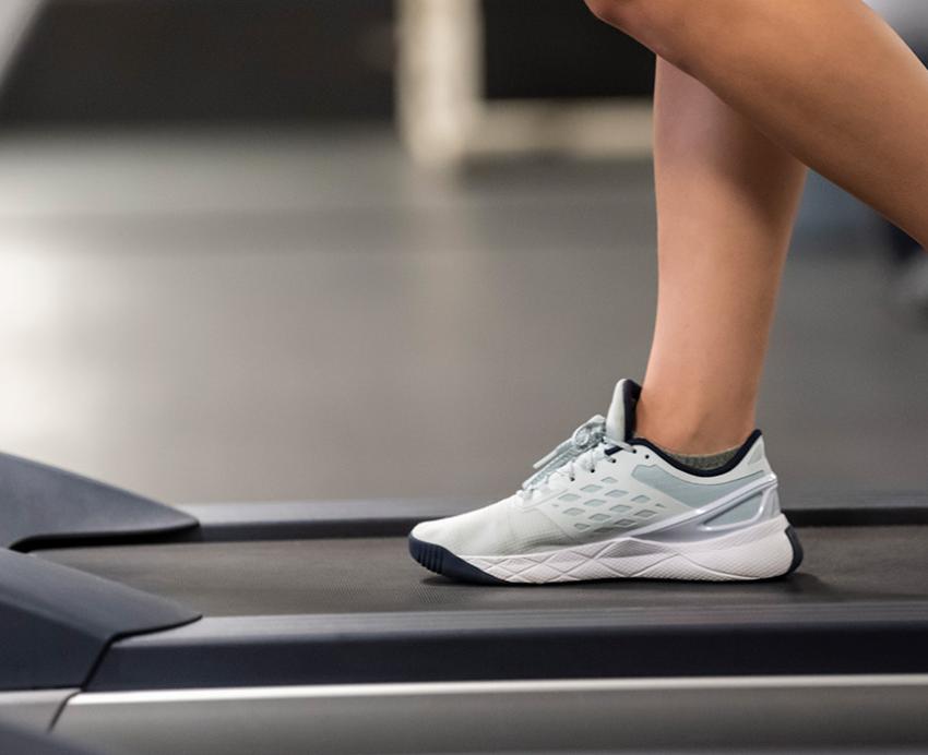 Feet walking on a treadmill
