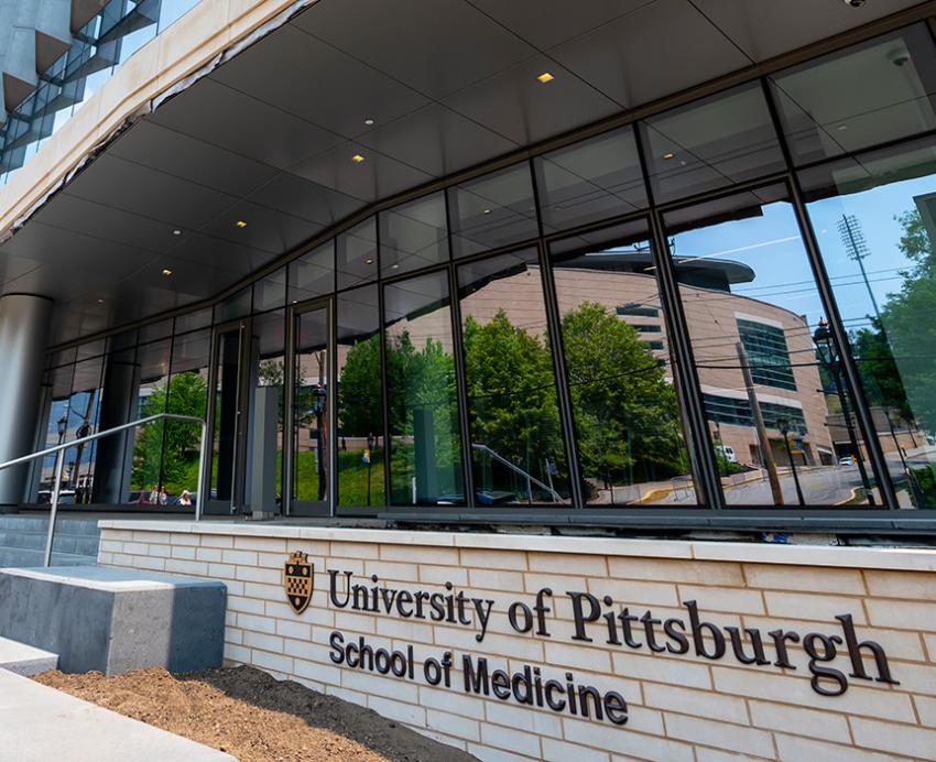 Building with sign reading "University of Pittsburgh School of Medicine"