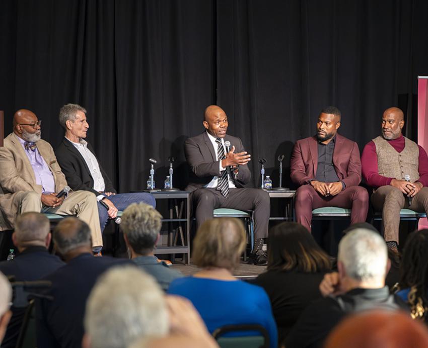 (seated, from left) Samuel W. Black, director of the African American Program at the Heinz History Center; Rob Ruck, professor of history in Pitt’s Kenneth P. Dietrich School of Arts and Sciences; Bobby’s son Rob Grier, Jr.; CNN journalist Fredricka Whitfield (far left). 