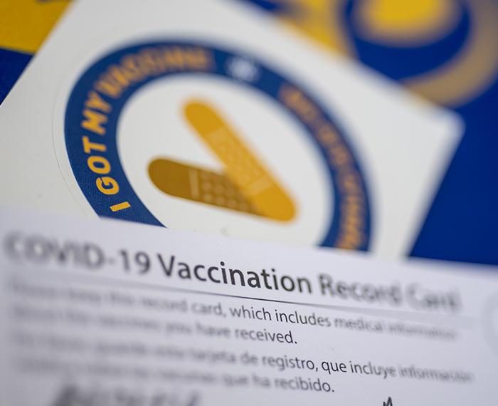 COVID vaccination card, vaccine sticker 
