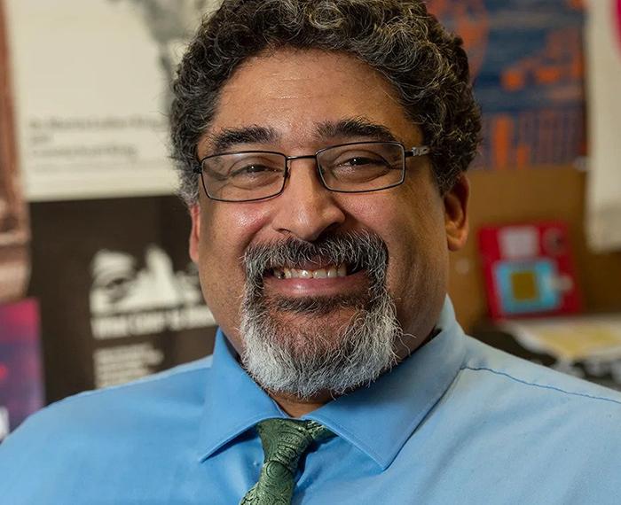 Geoffrey Glover in a blue shirt and green tie
