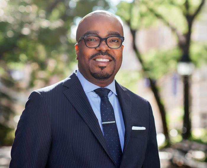 a man in a blue suit and tie