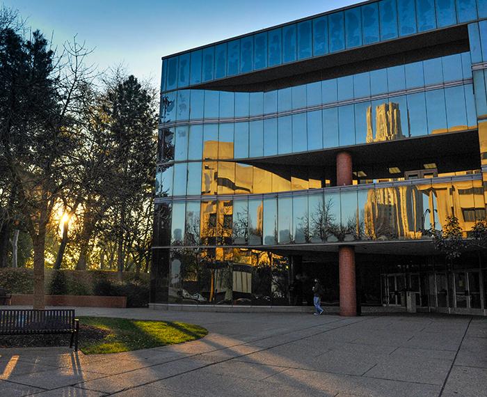 Mervis Hall with sunset in background