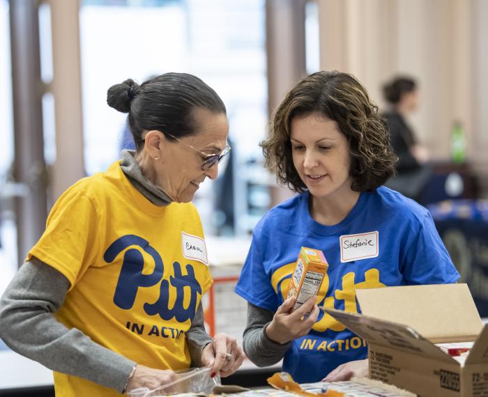 volunteers pack boxes