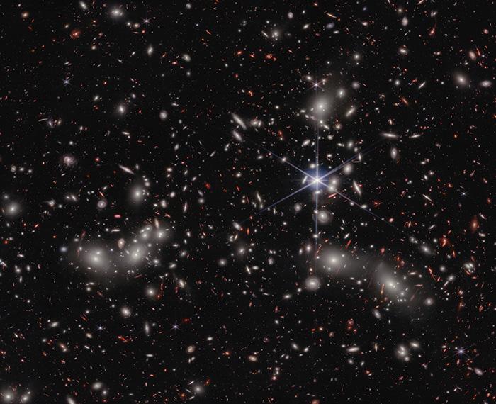 Mulitcolored galaxies against a black sky