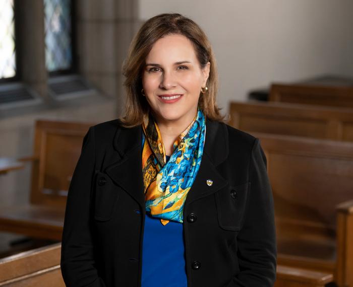 Gabel in a black blazer with a colorful scarf