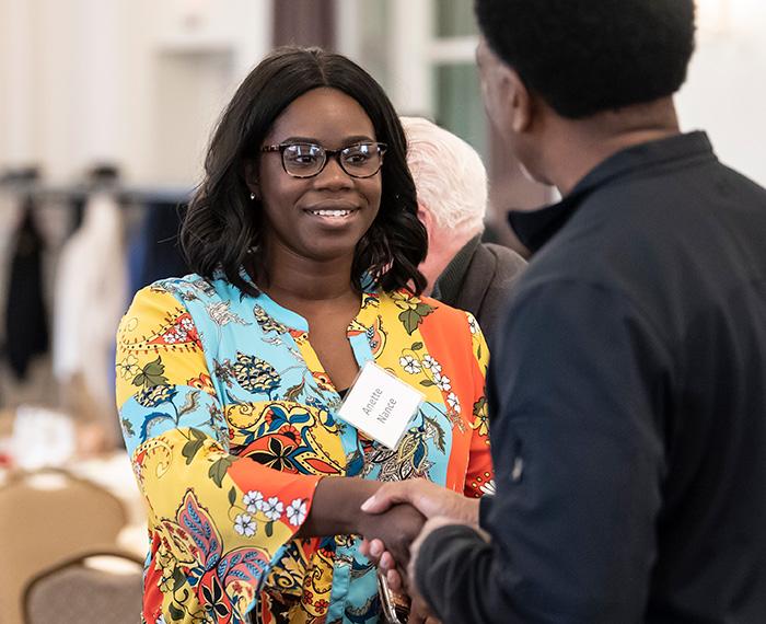 Anette Nance shaking a person's hand