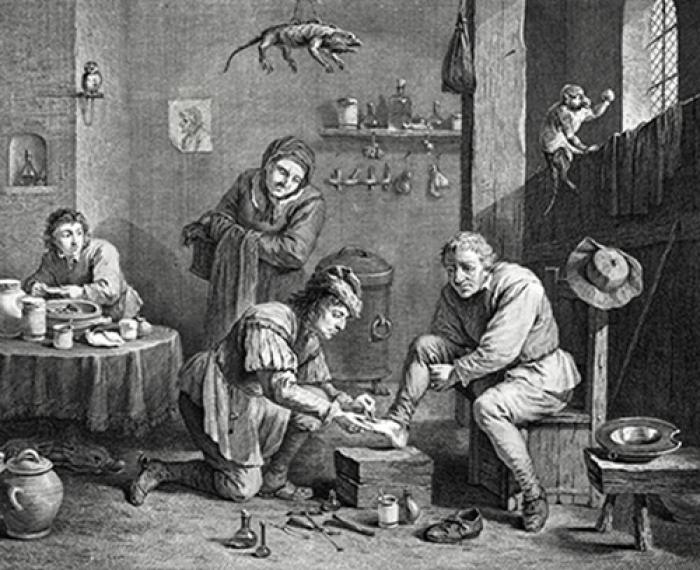 A man has leeches placed on his foot in this vintage illustration