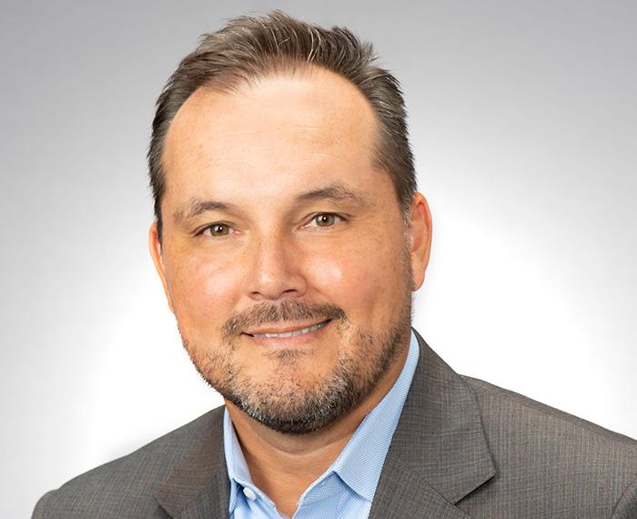 A headshot of Marroquin