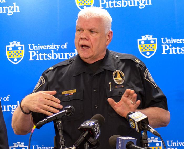 Loftus speaks at a Pitt press conference