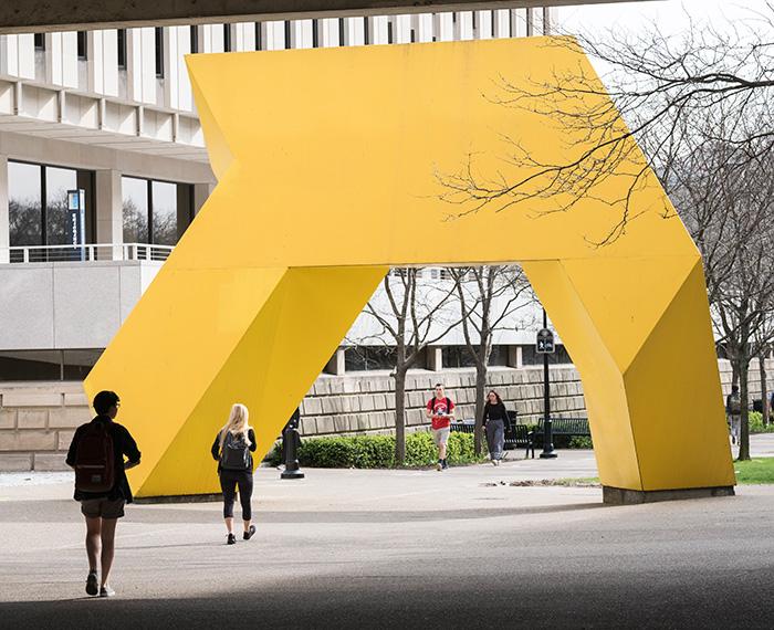 A yellow sculpture outside Posvar Hall