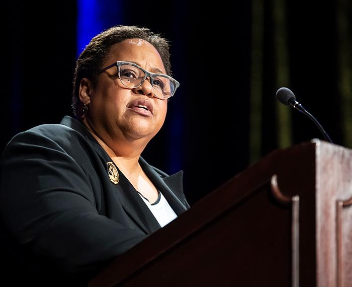 Murrell speaks at a podium