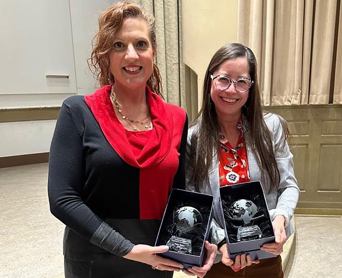 Doreen Hernández and Belkys Torres pose with their Michele Reid-Vazquez Commitment to Community Awards