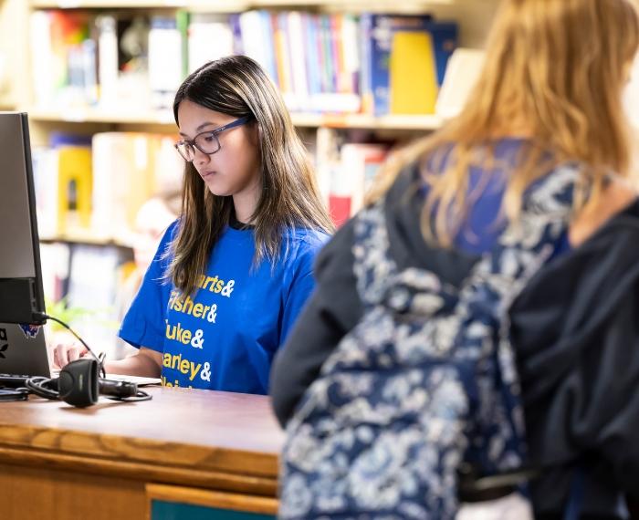 Two students in a library.