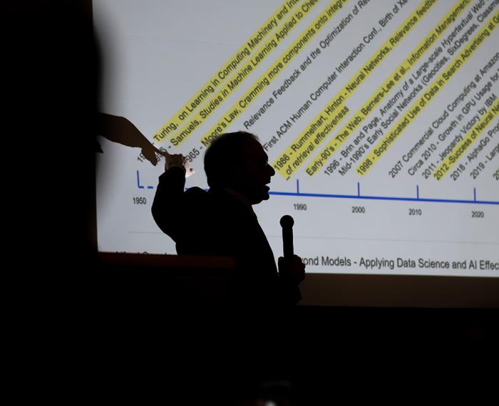 Silhouette of a SCI speaker during a conference.