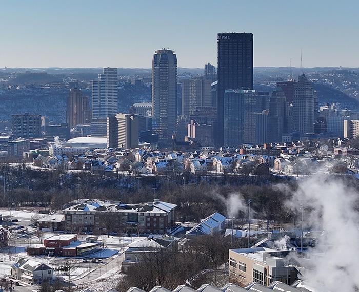 The Pittsburgh skyline behind a neighborhood