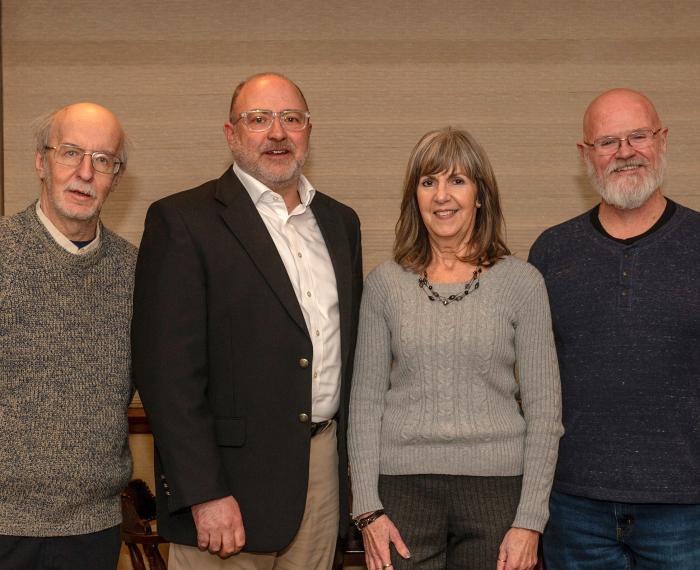 Group portrait of Pitt-Bradford faculty and staff members Bill Kline, David Soriano, Karen Strotmann, and Bob Dilks, who, along with 12 others, were honored for combined service that totals 366 years.