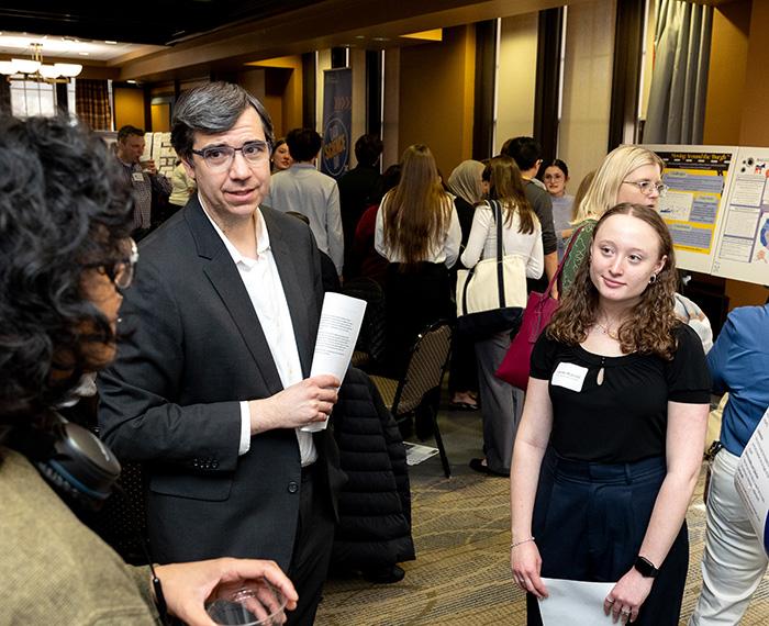 RSD scholar speaks with professors