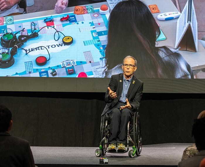 Rory Cooper speaking in front of an audience