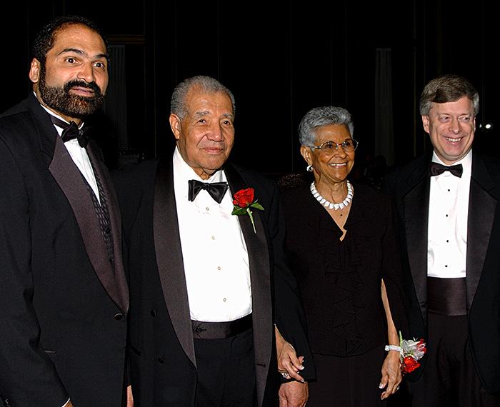 The Robinsons stand with Franco Harris and Mark Nordenberg.