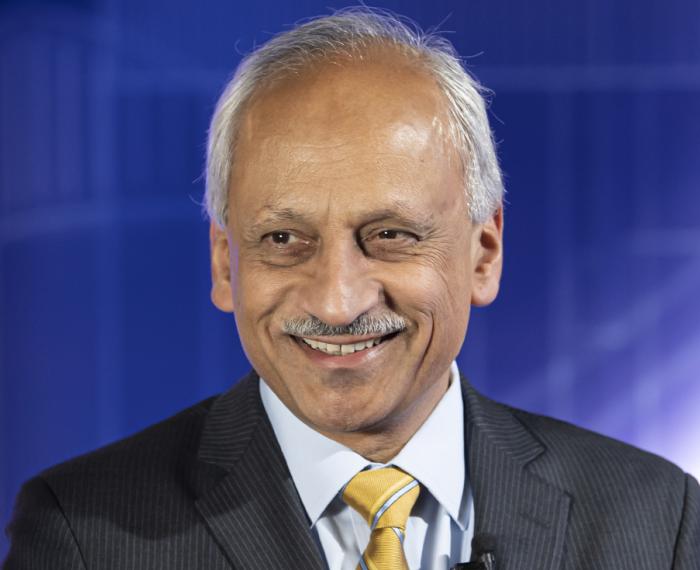 Anantha Shekhar in a dark gray suit