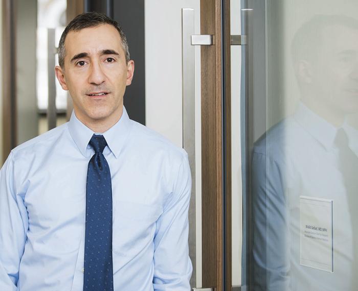 Gellad in a light blue shirt and dark blue tie