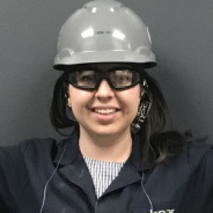 Cailyn Hall in a black jacket, grey hardhat and goggles