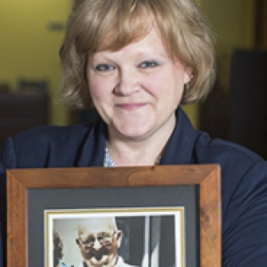 Wanda DiPaolo holding a photo of her father