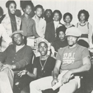 A black and white photograph of a group of people posing together