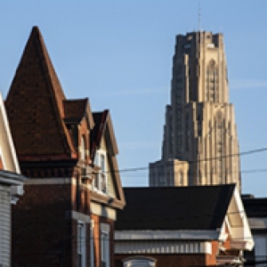 Three Pittsburgh houses with the Cathedral of Learning in the background