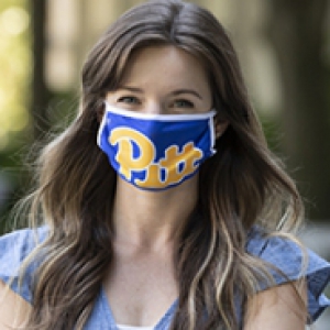 a woman in a Pitt branded blue and gold face covering with her arms crossed on her chest