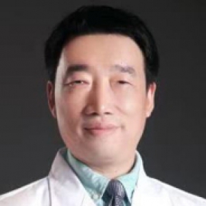 Zhiyong Peng in a white coat and a light blue shirt with a tie