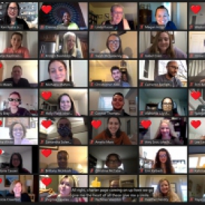 A Zoom meeting full of participants with the "heart" reaction on most panes