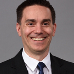David Lebel in a black suit and dark blue tie