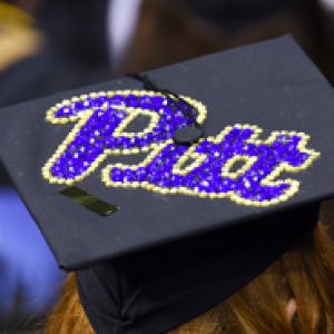 a mortarboard with Pitt script on top