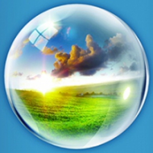 A depiction of a globe with a field and clouds within