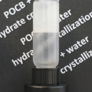 polymer and water mixture in a tube; background is white lettering on a black field