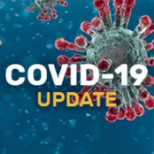 Image of cover-19 virus, portrayed in red on a blue background. Words COVID-19 Update overlaid