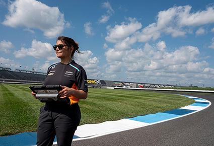 Woman standing on race track 
