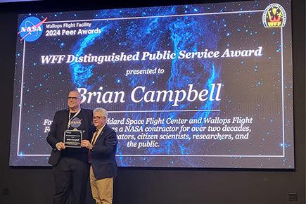 Photo of man receiving award