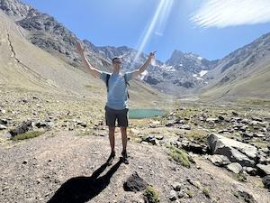 Man standing in front of mountains
