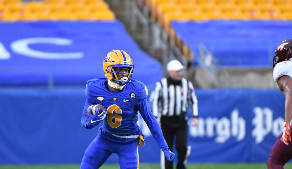 Tre Tipton in blue football uniform and gold helmet