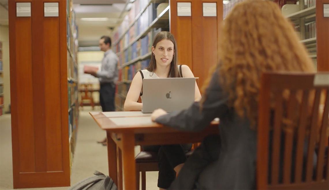 Students work in a library